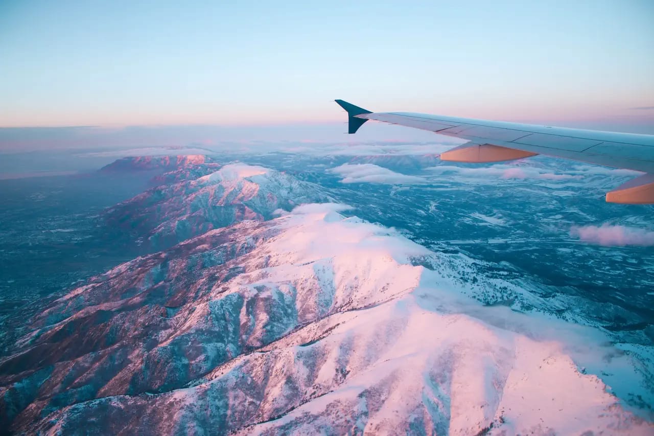 acrophobia - airplane window overlooking mountains