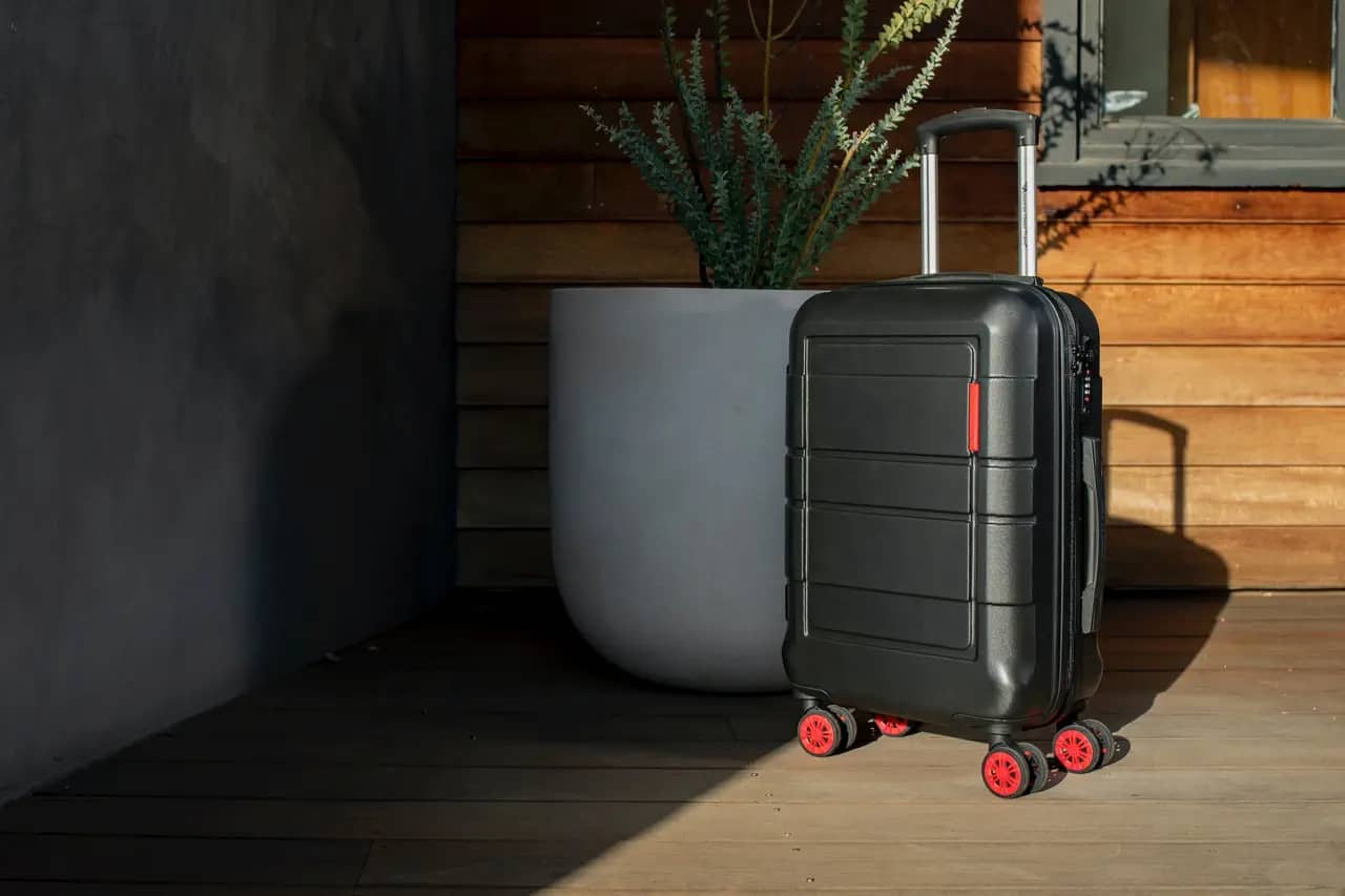 common carry-on mistakes - rolling luggage in sun